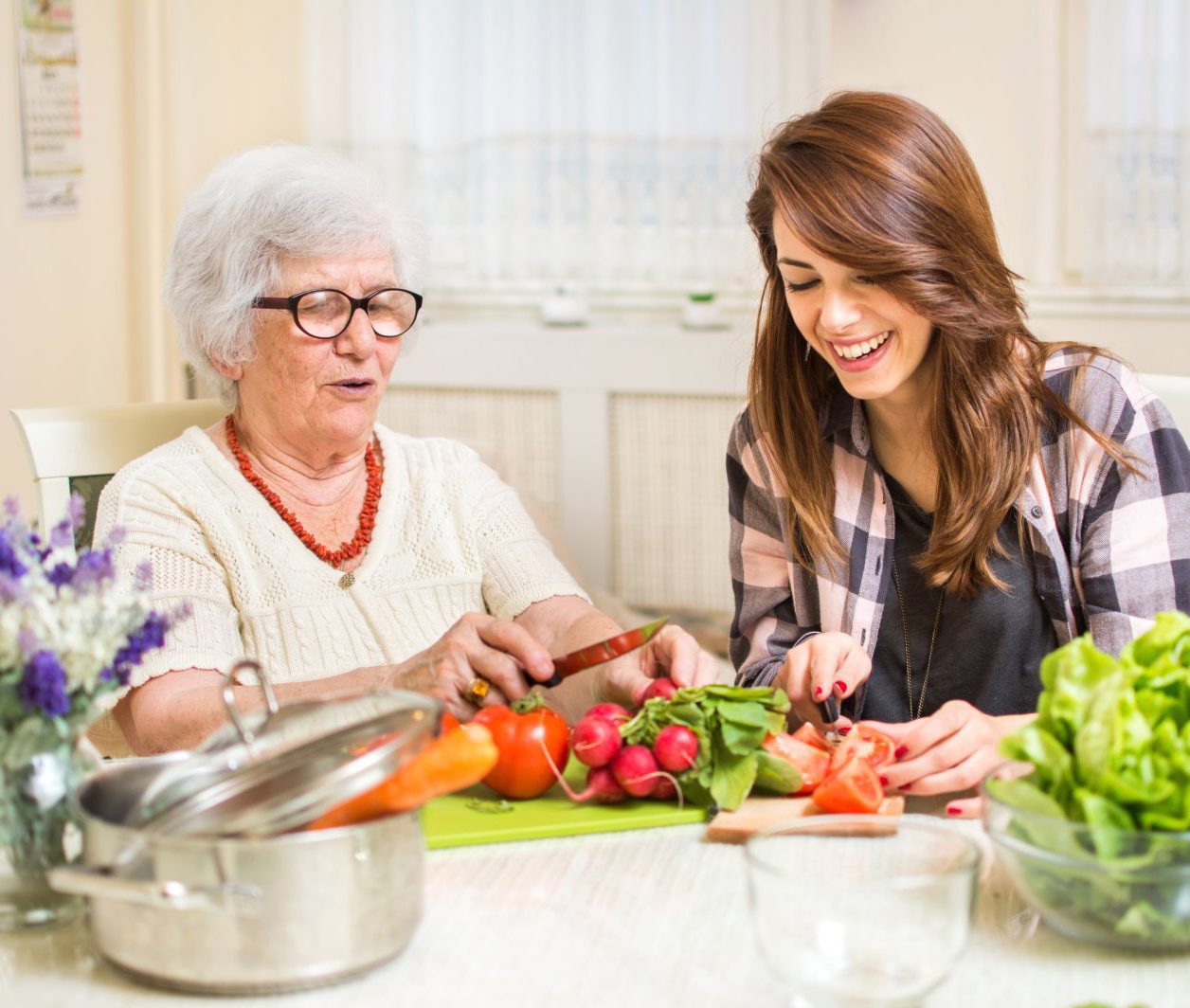 Senior living at home cooking with family